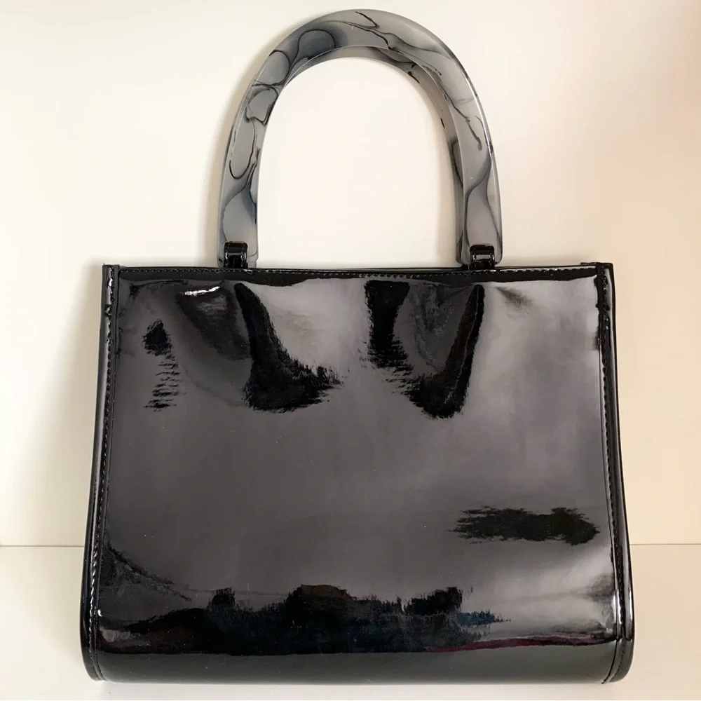 Hold NWOT Neiman Marcus black patent marble handle modern bag